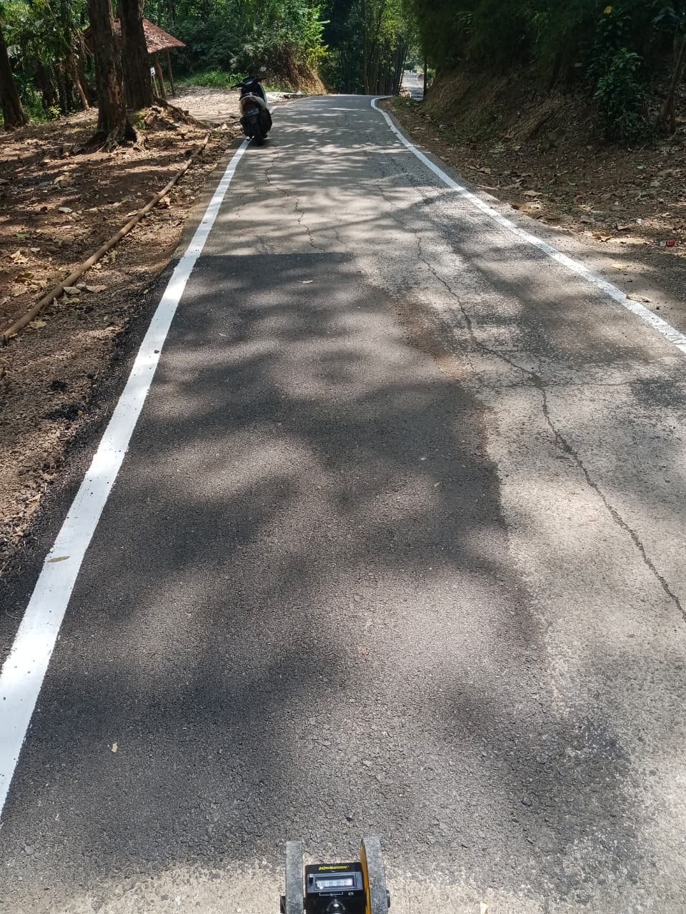 KEGIATAN PERBAIKAN JALAN KABUPATEN DI DESA SALAMMULYA, KECAMATAN PONDOKSALAM, KABUPATEN PURWAKARTA MELALUI PROGRAM CSR BANK BJB